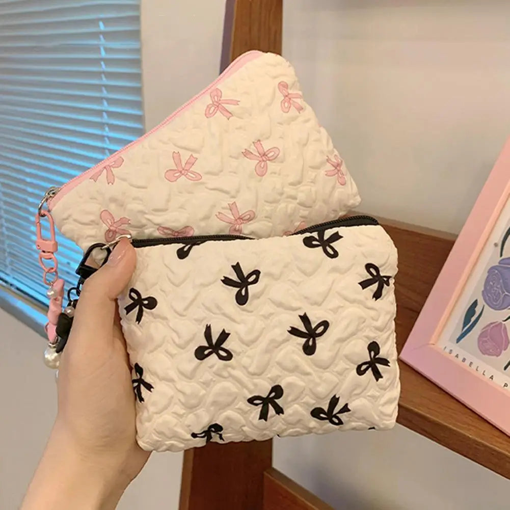 Bow-Print Polyester Mini Cosmetic Pouch — 14 × 10 cm