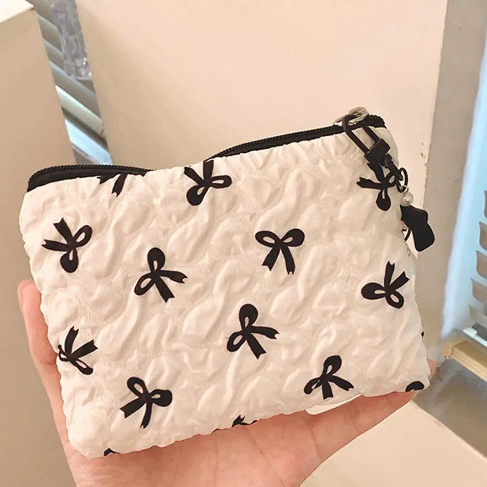 Bow-Print Polyester Mini Cosmetic Pouch — 14 × 10 cm