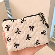 Bow-Print Polyester Mini Cosmetic Pouch — 14 × 10 cm