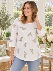 Ana and Rose ivory embroidered tunic styled on a model
