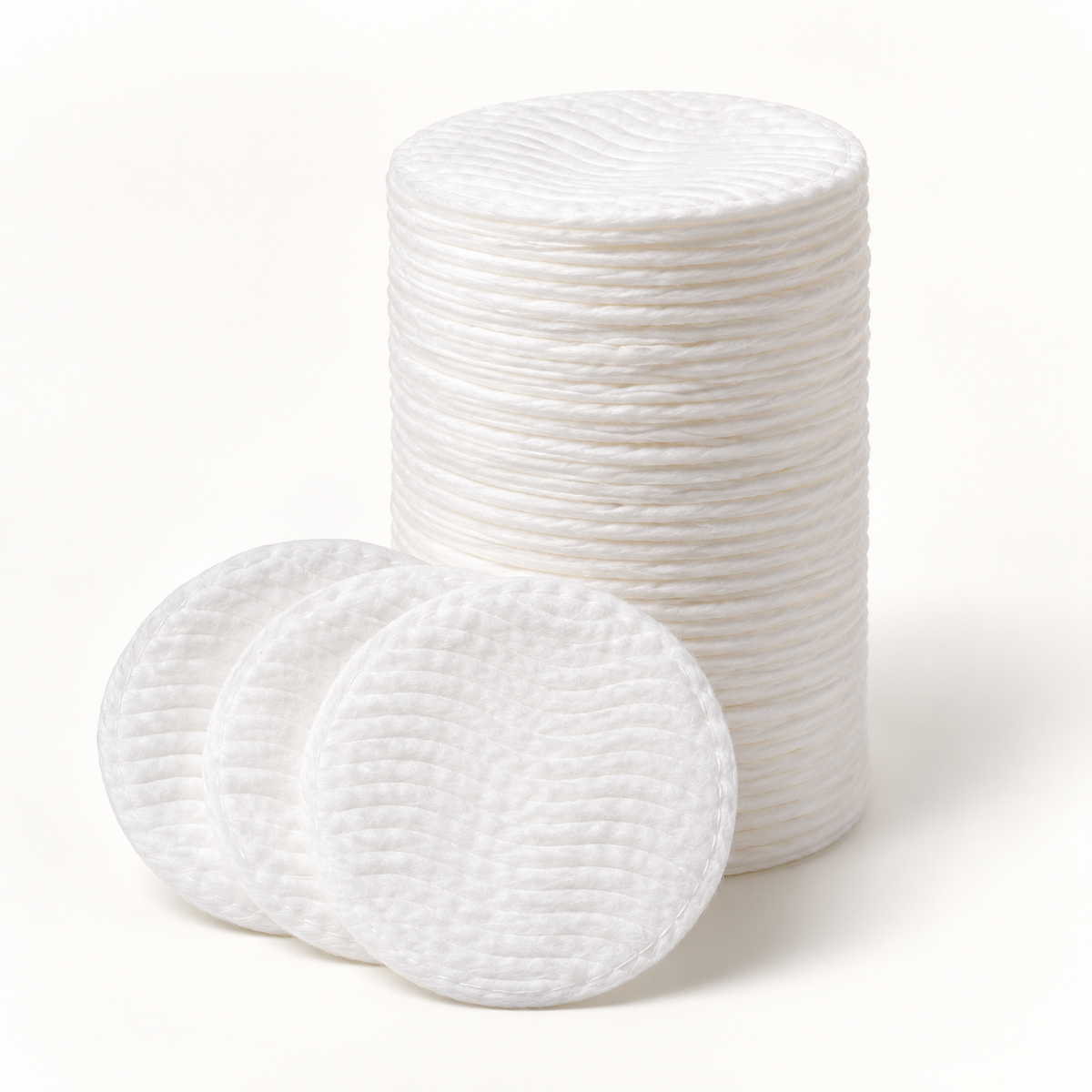 Assured cotton rounds arranged on a white studio background