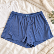 Auden navy women's sleep shorts in a premium bedroom setting