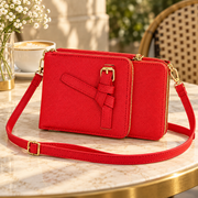 Chic Unlimited red triple-zip crossbody wallet lifestyle view