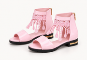 Pink lace fringe ankle sandals with gold-tone heel trim