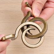 Hooked Ring Metal Disentanglement Puzzle held in hands