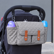 Gray organizer attached to a stroller