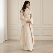 Woman wearing cream long coat and skirt set