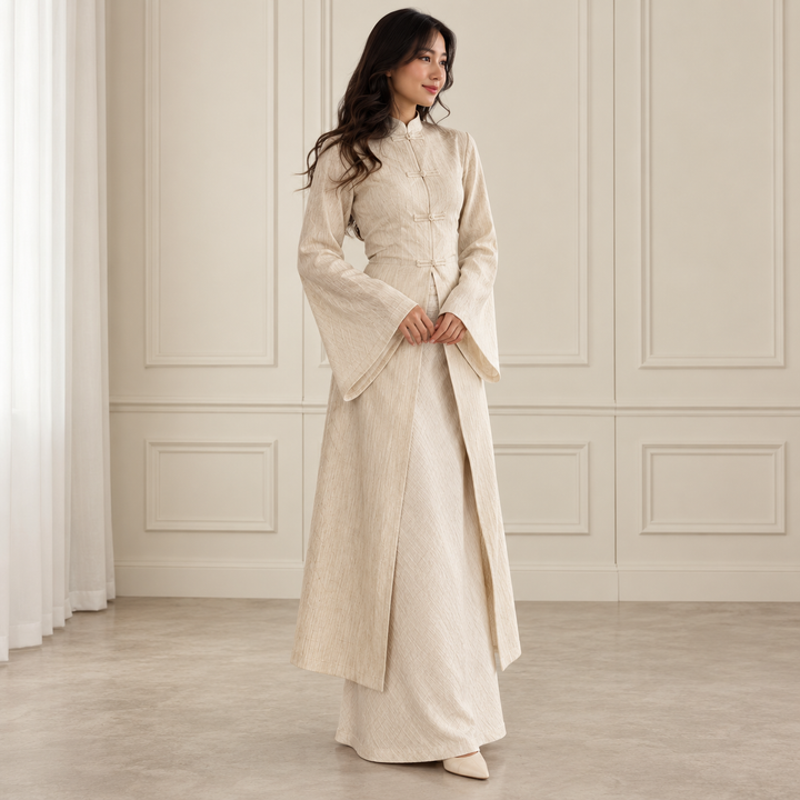 Woman wearing cream long coat and skirt set