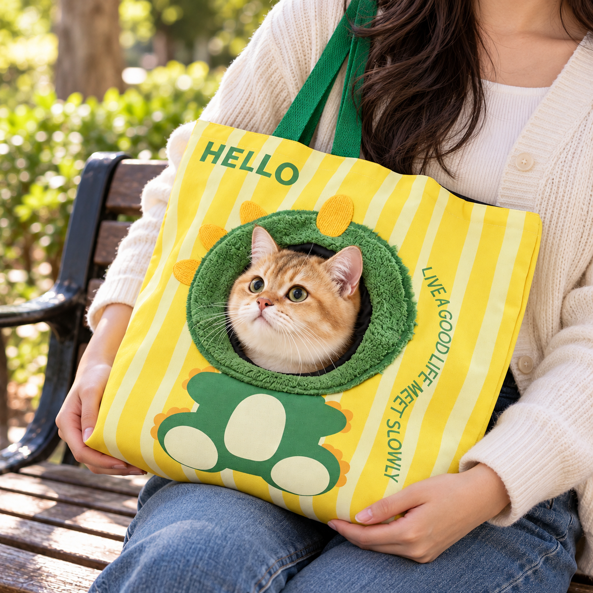 Canvas cat carrier supported during a supervised outdoor outing, scene 2
