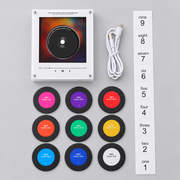 Music fridge magnet kit with nine discs, cable and numbered stickers