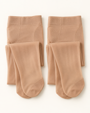 Two pairs of nude control-top sheer pantyhose on warm white