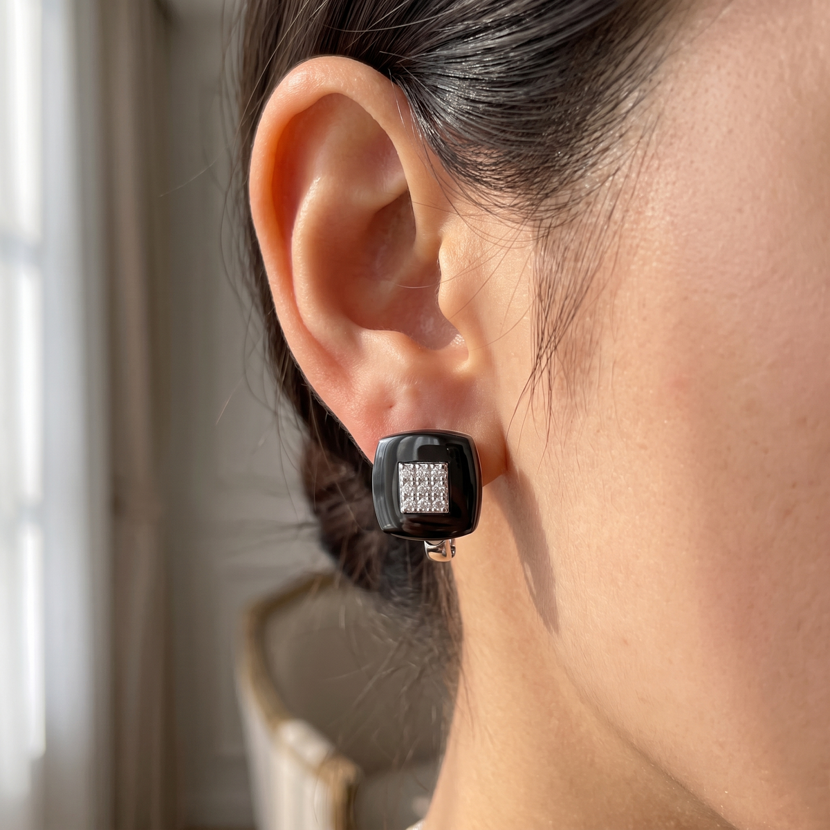 black square ceramic stud earring worn