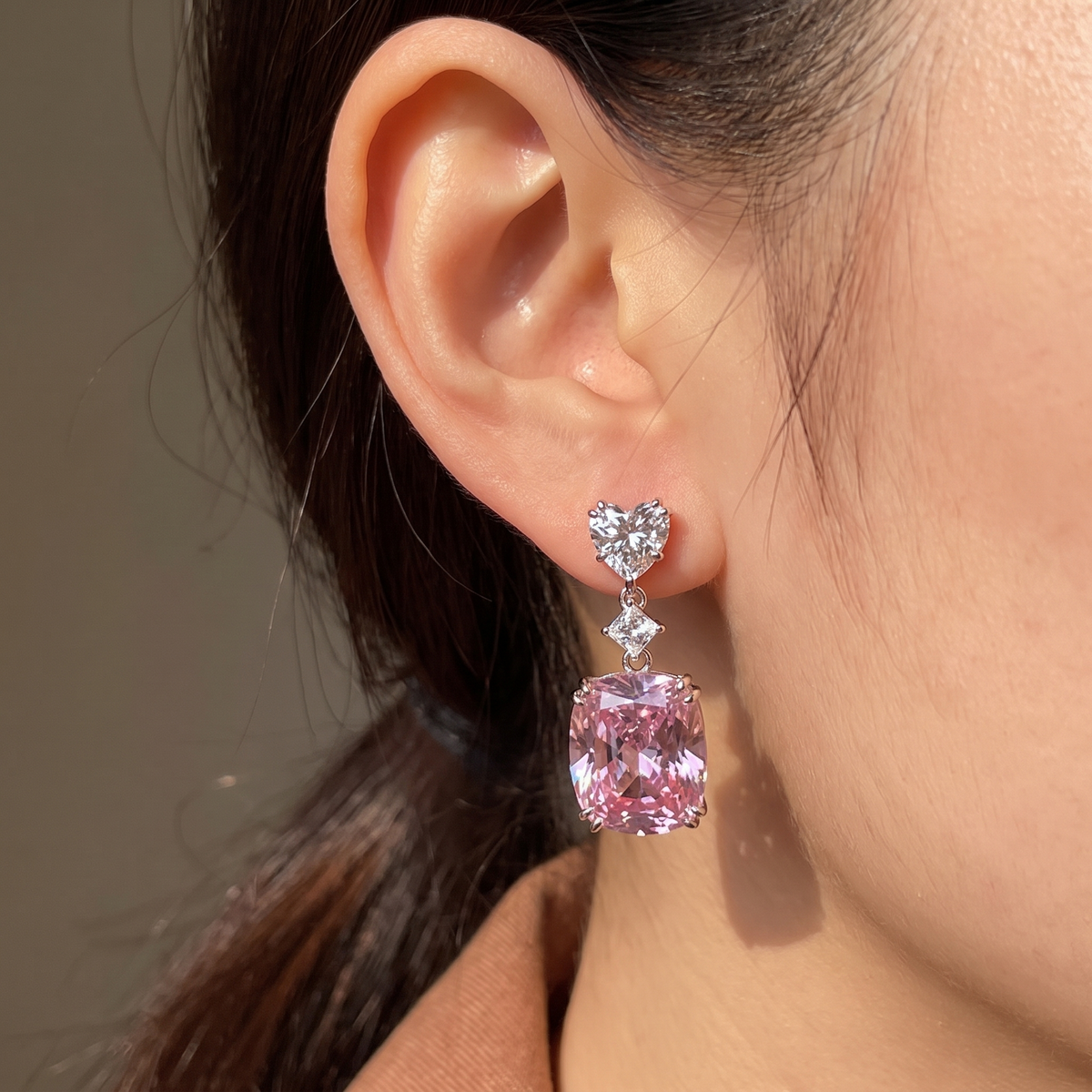 pink geometric drop earrings worn