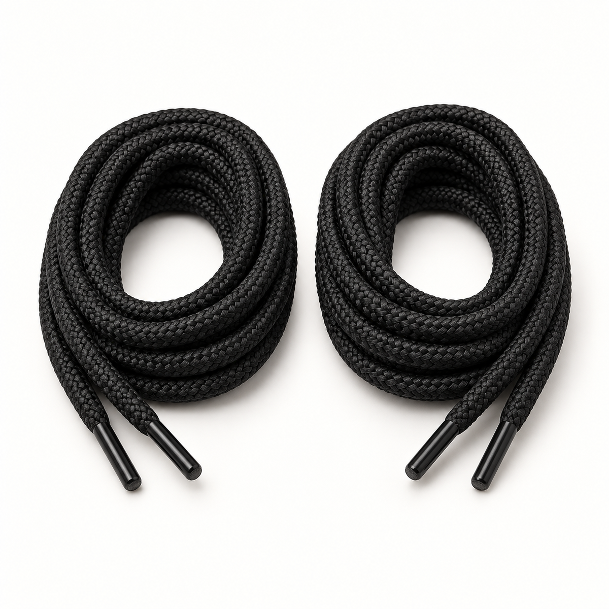 Pair of KIWI Outdoor round black shoelaces coiled on a white studio background