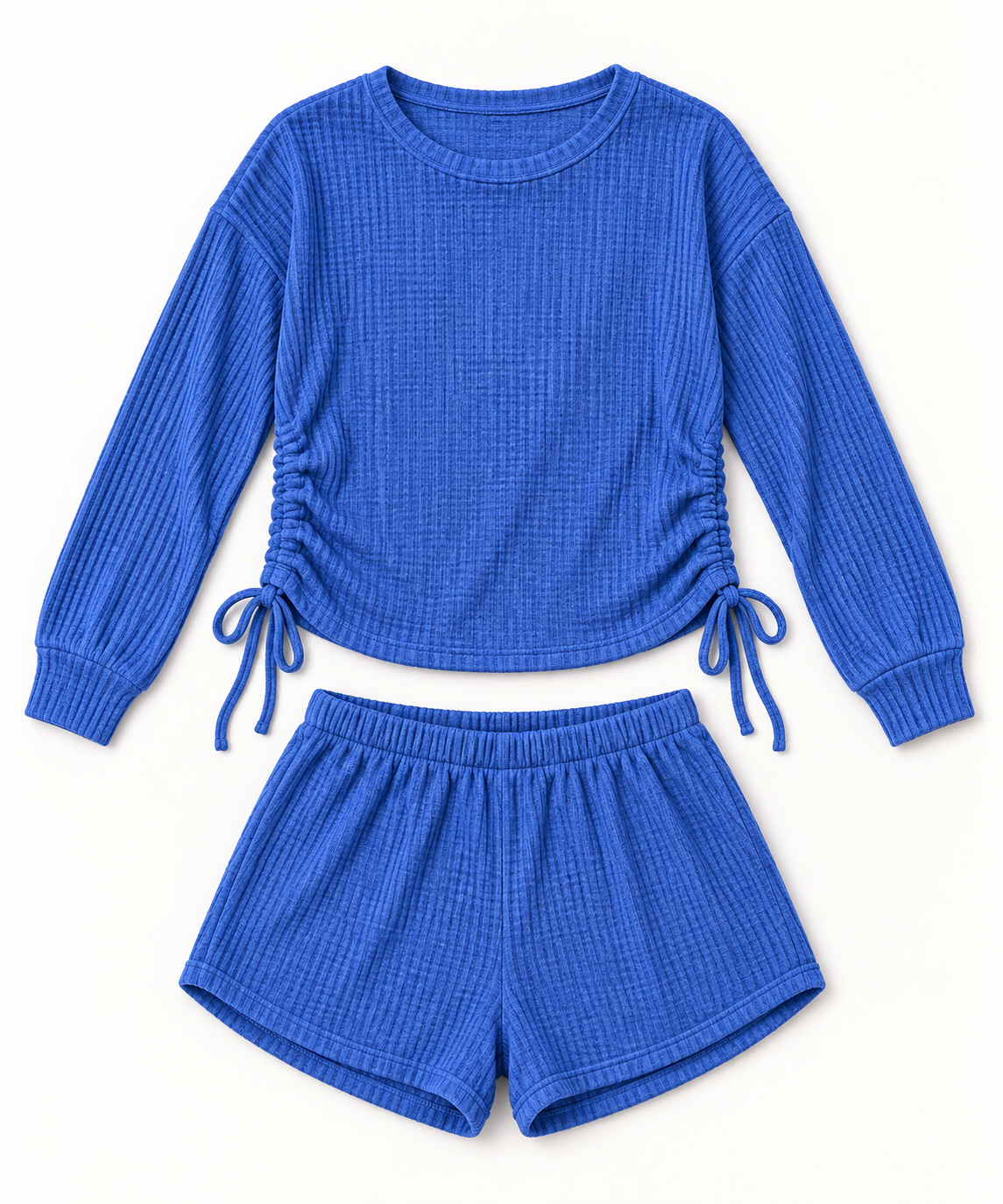 Women's cobalt-blue waffle-knit top and shorts set on a studio background