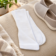 Men's white diabetic comfort crew socks in a premium lifestyle setting