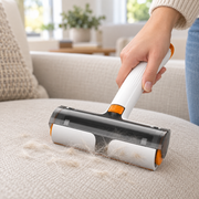 Reusable pet hair remover roller used on sofa
