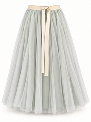 Sage layered tulle maxi skirt with champagne ribbon waist on a studio background